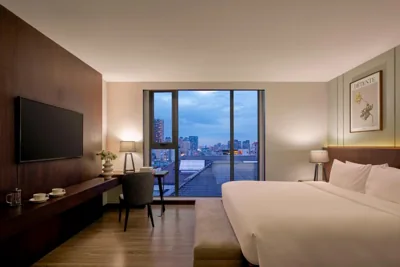 Deluxe Room — Grand Signature by M Village Lê Thánh Tôn, a brand of Modern Village Lifestyle